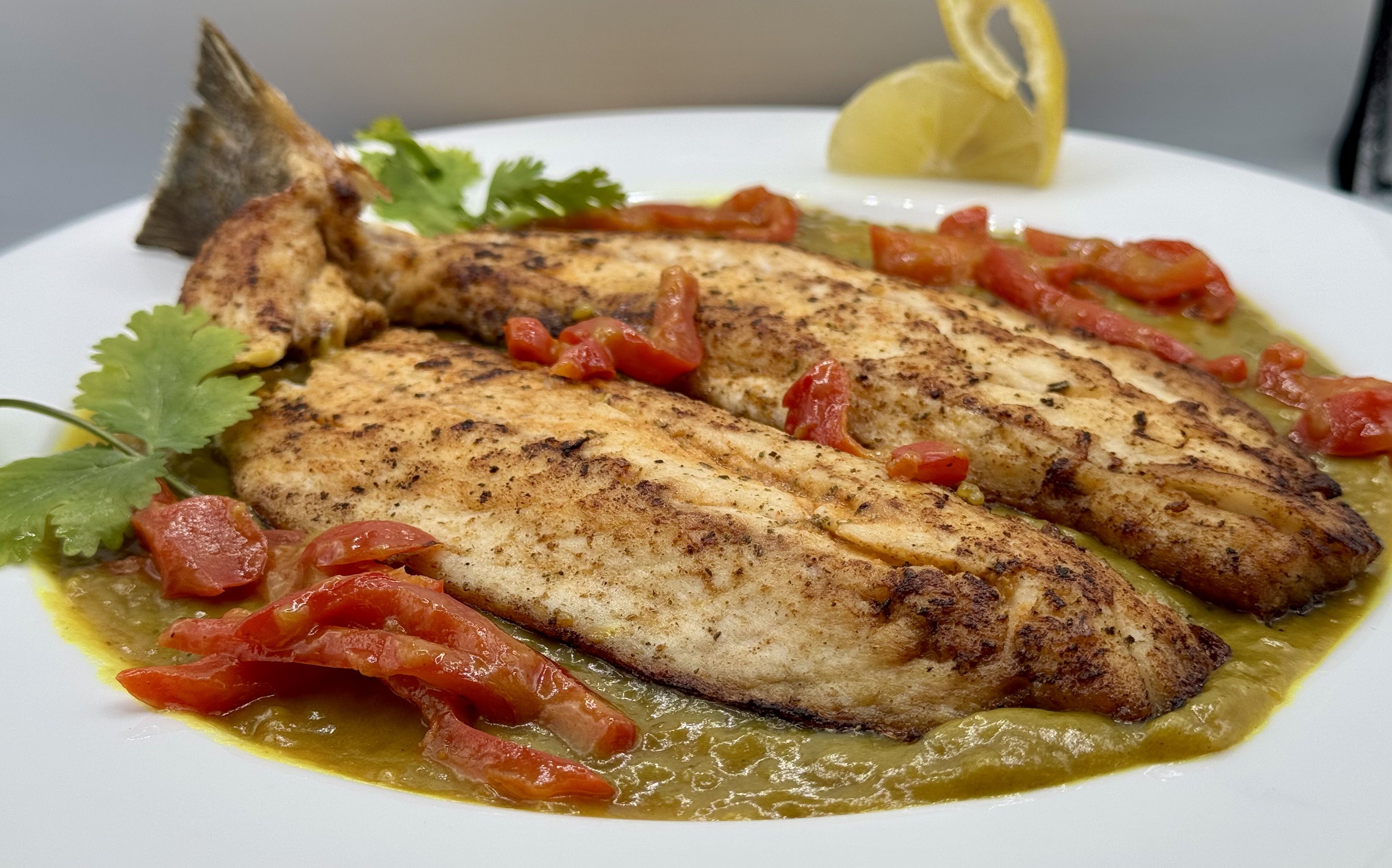 Whole Pan-Seared Branzino with Red Peppers in a Coconut Curry Sauce