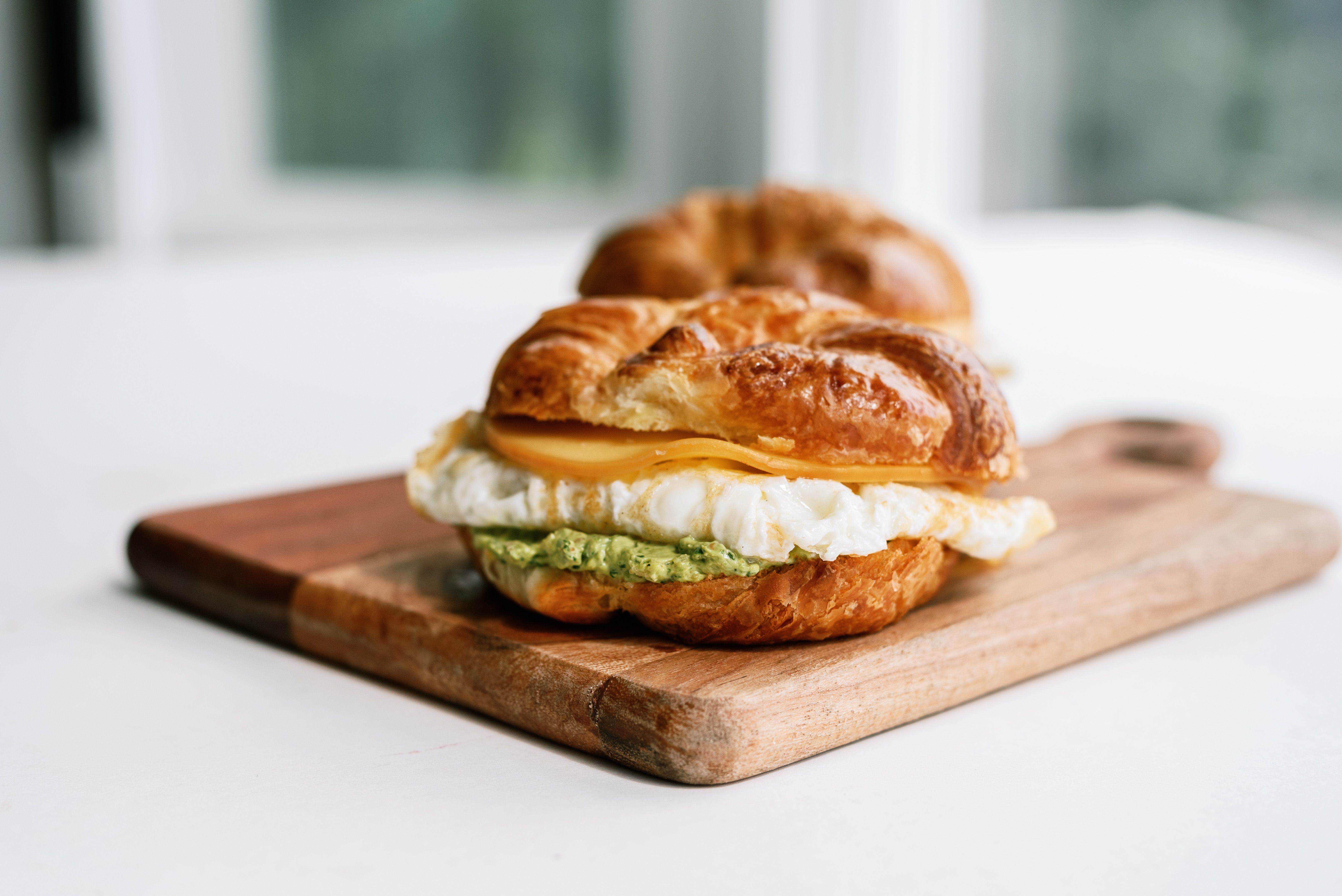 Egg White Breakfast Croissant Sandwich with Whole Fruit